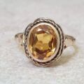 Vibrant Synthetic Yellow Sapphire in 9ct Gold, a UK N or a US 7