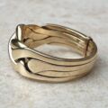 Four piece Puzzle Ring in 9ct Gold,  a UK P 1/2 or a US 8.