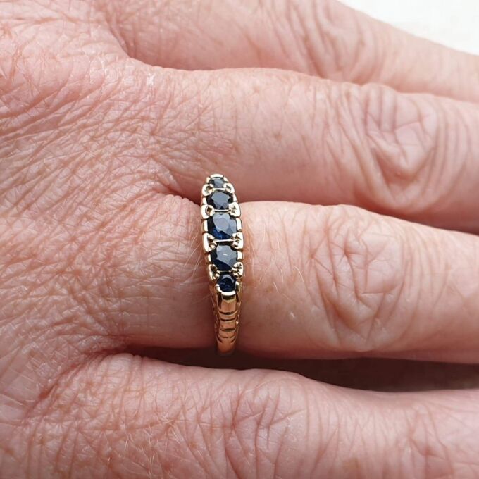 Blue Sapphire Five Stone Ring in 9ct Yellow Gold, a UK K 1/2 or a US 5 3/4.