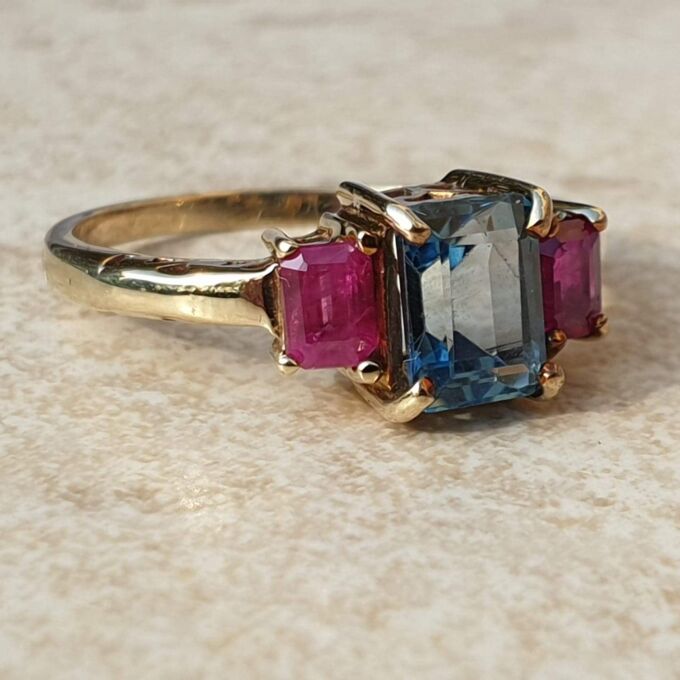 Topaz and Synthetic Ruby Trilogy Ring in 9ct Gold.