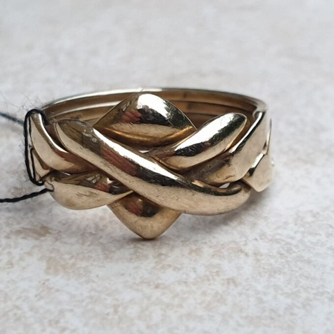 Four Piece Puzzle Ring in 9ct Gold, a UK N 1/2 or a US 7 1/2