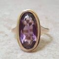 Elongated Oval Amethyst Solitaire Ring in 9ct gold.