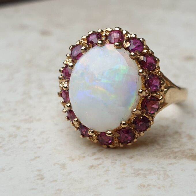 Opal & Ruby Ring in 9ct Gold, a UK O or a US 7 1/2