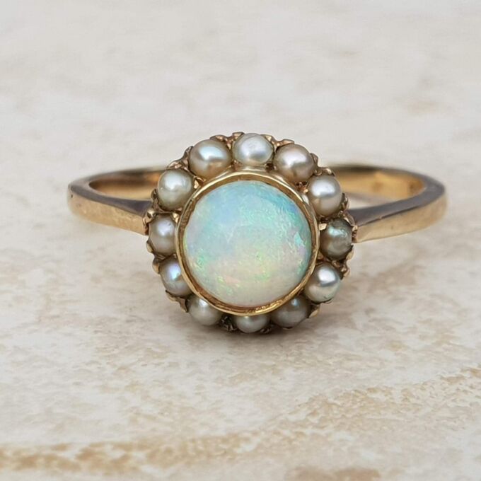 Stunning Opal and Split Pearl Halo Ring in 9ct Gold, a UK L 1/2 or a US 6 1/4.
