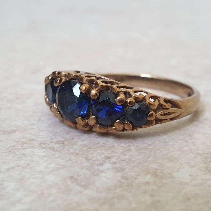 Vibrant Blue Five Stone Synthetic Sapphire Ring in 9ct Gold, a UK N or a US 7.