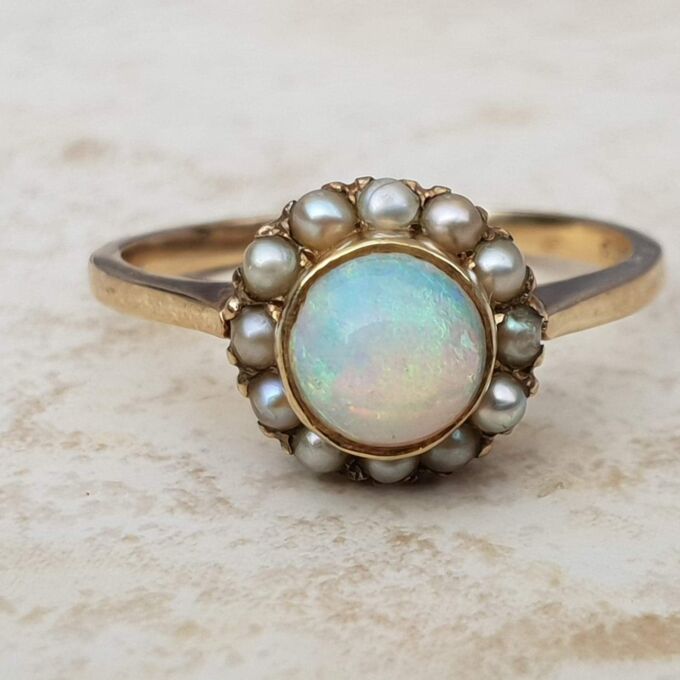 Stunning Opal and Split Pearl Halo Ring in 9ct Gold, a UK L 1/2 or a US 6 1/4.