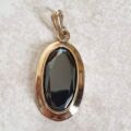 Oval Hematite Pendant in 9ct Gold.