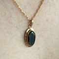 Oval Hematite Pendant in 9ct Gold.