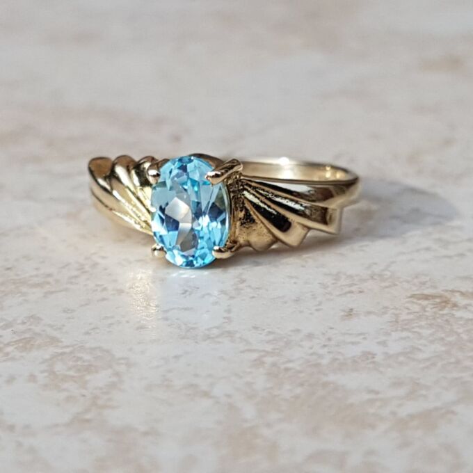 Oval Sky Blue Topaz Solitaire Ring in 9ct Gold, a UK J or a US 5.