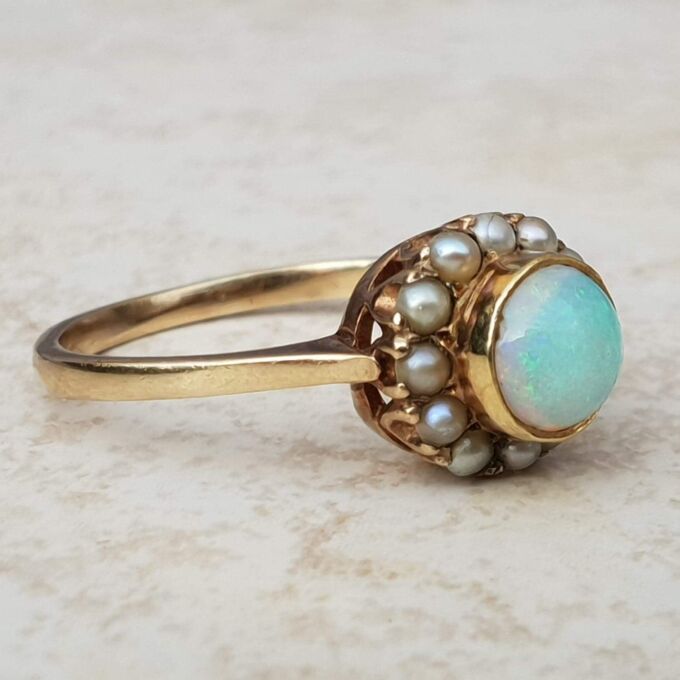 Stunning Opal and Split Pearl Halo Ring in 9ct Gold, a UK L 1/2 or a US 6 1/4.