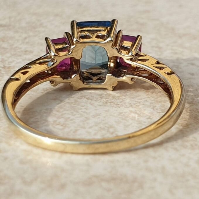 Topaz and Synthetic Ruby Trilogy Ring in 9ct Gold.