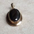 Oval Hematite Pendant in 9ct Gold.