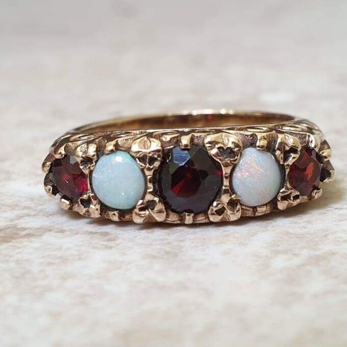 Five Stone Opal and Garnet 9ct Gold Ring, a UK K 1/2 or a US size 5 3/4.