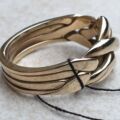 Four Piece Puzzle Ring in 9ct Gold, a UK N 1/2 or a US 7 1/2