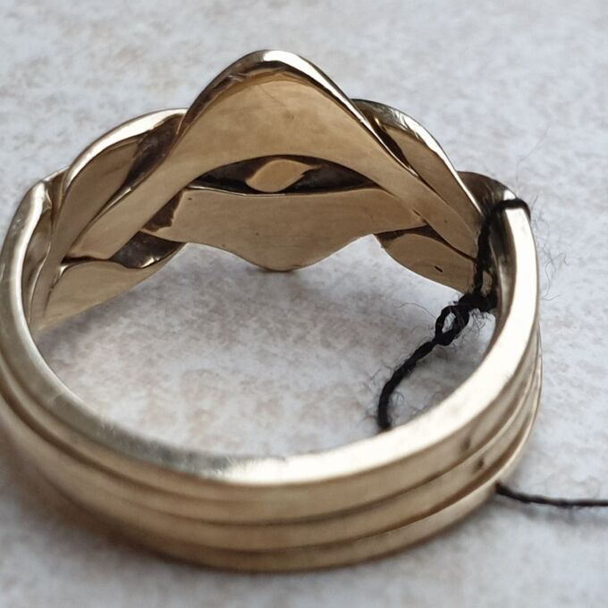 Four Piece Puzzle Ring in 9ct Gold, a UK N 1/2 or a US 7 1/2