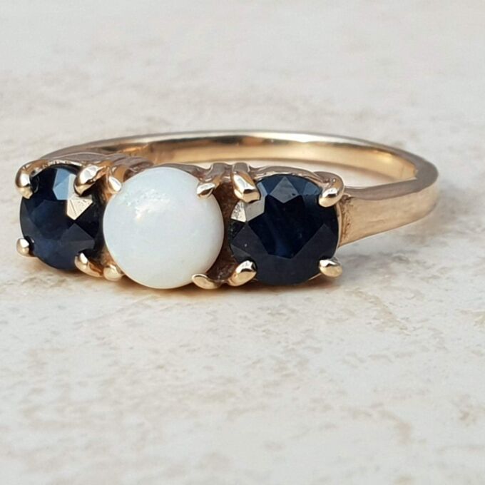 Opal and Sapphire Trilogy Ring in 9ct Gold, a UK J 1/2 or a US 5 1/4.