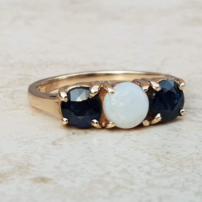 Opal and Sapphire Trilogy Ring in 9ct Gold, a UK J 1/2 or a US 5 1/4.