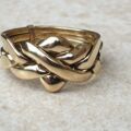 Four piece Puzzle Ring in 9ct Gold,  a UK P 1/2 or a US 8.
