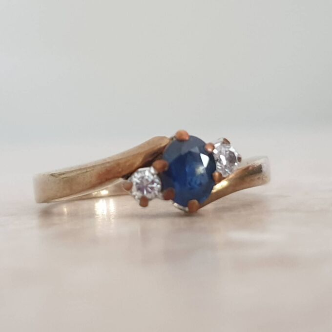 Sapphire and Diamond Trilogy Bypass Ring in 9ct Gold, a UK I 1/2 or a US 4 3/4.