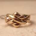 Four Piece Puzzle Ring in 9ct Gold, a UK N 1/2 or a US 7 1/2