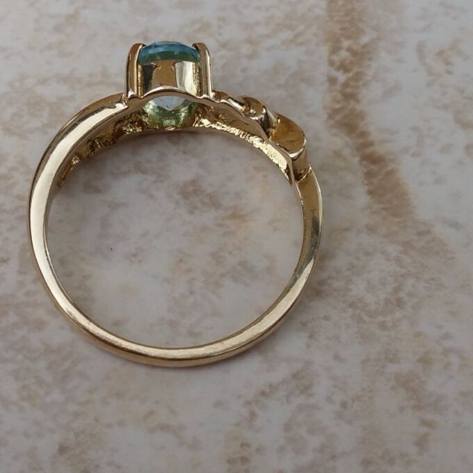 Oval Sky Blue Topaz Solitaire Ring in 9ct Gold, a UK J or a US 5.