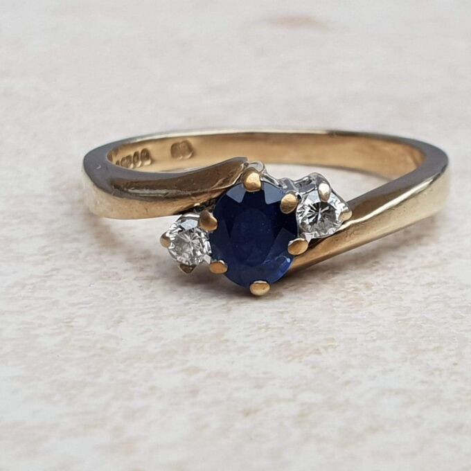 Sapphire and Diamond Trilogy Bypass Ring in 9ct Gold, a UK I 1/2 or a US 4 3/4.