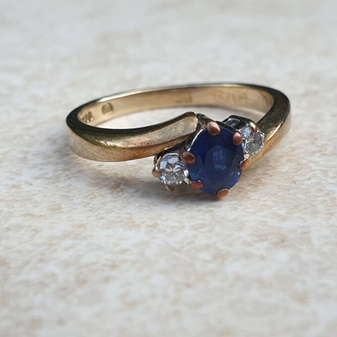 Sapphire and Diamond Trilogy Bypass Ring in 9ct Gold, a UK I 1/2 or a US 4 3/4.