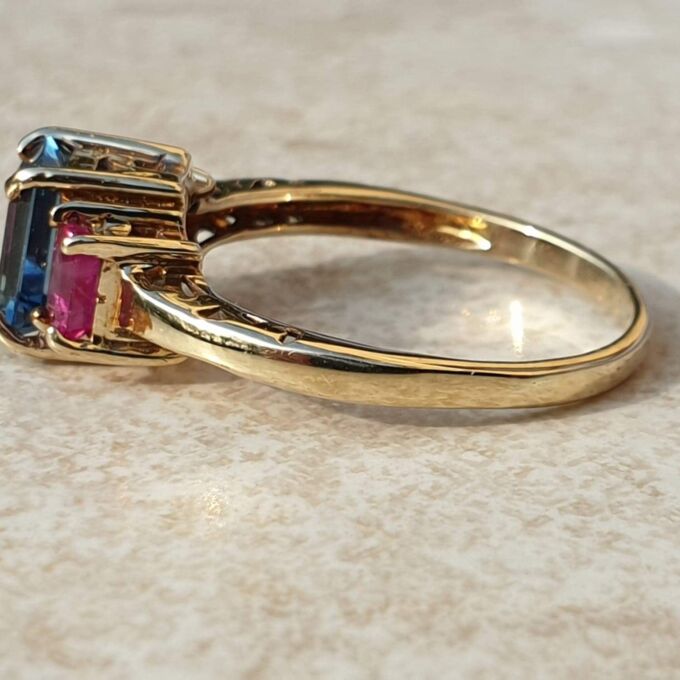 Topaz and Synthetic Ruby Trilogy Ring in 9ct Gold.