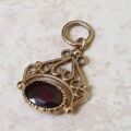 Tiny Garnet Fob Charm in 9ct Gold