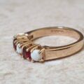 Opal and Garnet Ring in 9ct Gold, a UK J or a US 5