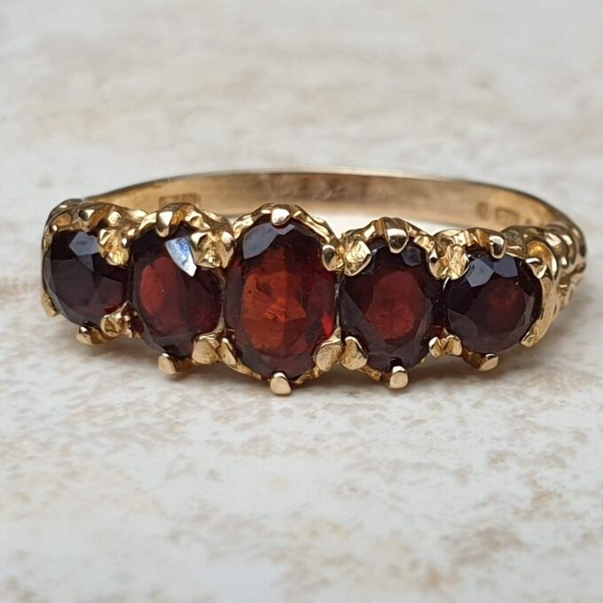 Five Stone Graduating Ring in 9ct Gold,  a UK R or a US 9.