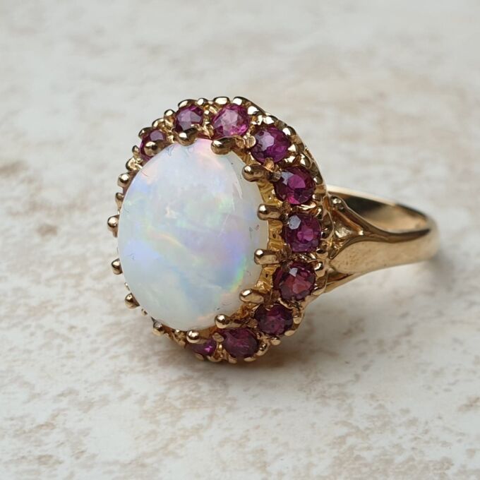 Opal & Ruby Ring in 9ct Gold, a UK O or a US 7 1/2