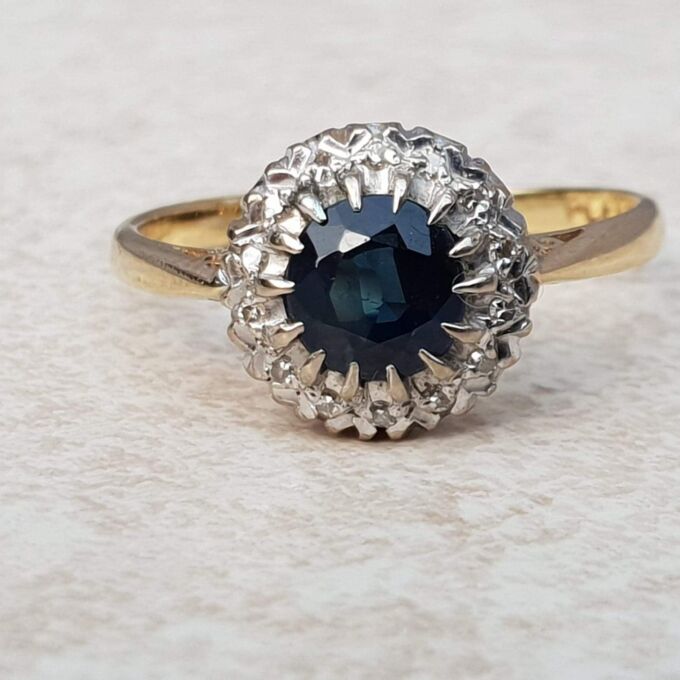 Sapphire and Diamond Halo ring in 18ct Gold and Platinum, a UK M or a US 6 1/2.