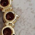Garnet Twelve Stone Circular Brooch in 9ct Gold