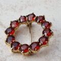 Garnet Twelve Stone Circular Brooch in 9ct Gold