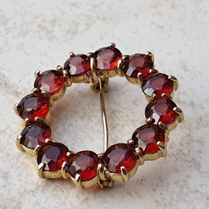 Garnet Twelve Stone Circular Brooch in 9ct Gold