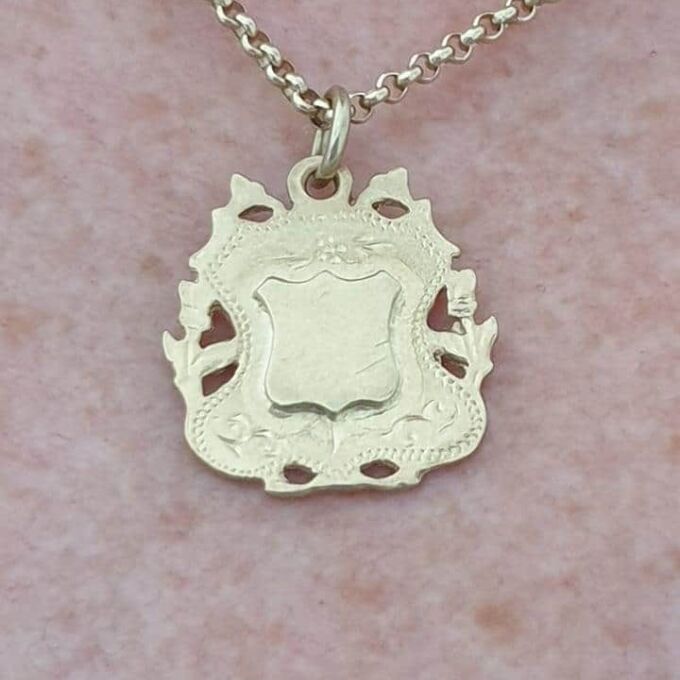 Ornate Shield Medallion in 9ct Gold.