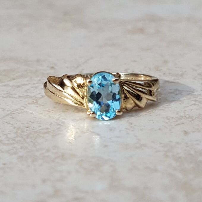Oval Sky Blue Topaz Solitaire Ring in 9ct Gold, a UK J or a US 5.