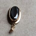 Oval Hematite Pendant in 9ct Gold.