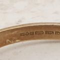 REGARDS Acrostic Ring in 9ct Gold, a UK O or a US 7 1/2
