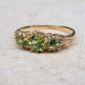 Summery Peridot Three Stone Ring in 9ct Gold, a UK N 1/2 or a US 7 1/4.