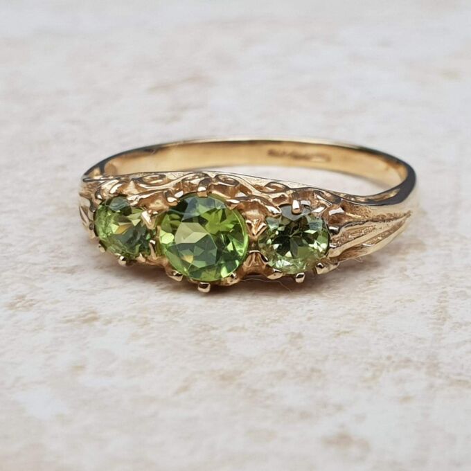 Summery Peridot Three Stone Ring in 9ct Gold, a UK N 1/2 or a US 7 1/4.