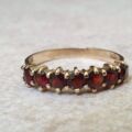 Seven Stone Garnet Band in 9ct Gold, a UK L 1/2 or a US 6
