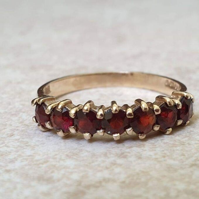 Seven Stone Garnet Band in 9ct Gold, a UK L 1/2 or a US 6