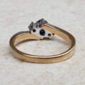 Sapphire and Diamond Trilogy Bypass Ring in 9ct Gold, a UK I 1/2 or a US 4 3/4.
