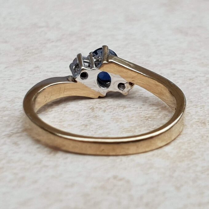 Sapphire and Diamond Trilogy Bypass Ring in 9ct Gold, a UK I 1/2 or a US 4 3/4.