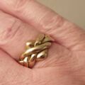 Four Piece Puzzle Ring in 9ct Gold, a UK N 1/2 or a US 7 1/2