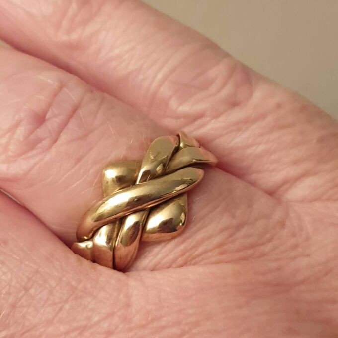 Four Piece Puzzle Ring in 9ct Gold, a UK N 1/2 or a US 7 1/2