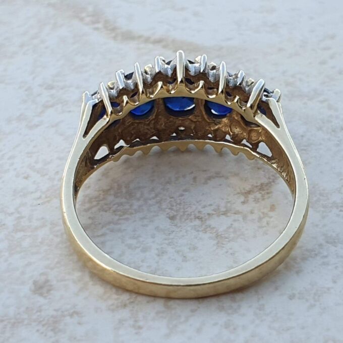 Graduating Synthetic Sapphire Five Stone Ring in 10k Gold.