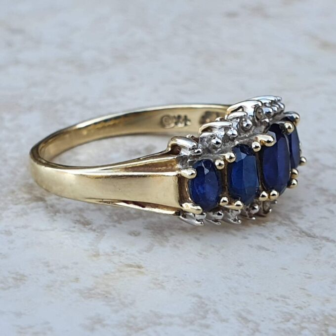 Graduating Synthetic Sapphire Five Stone Ring in 10k Gold.